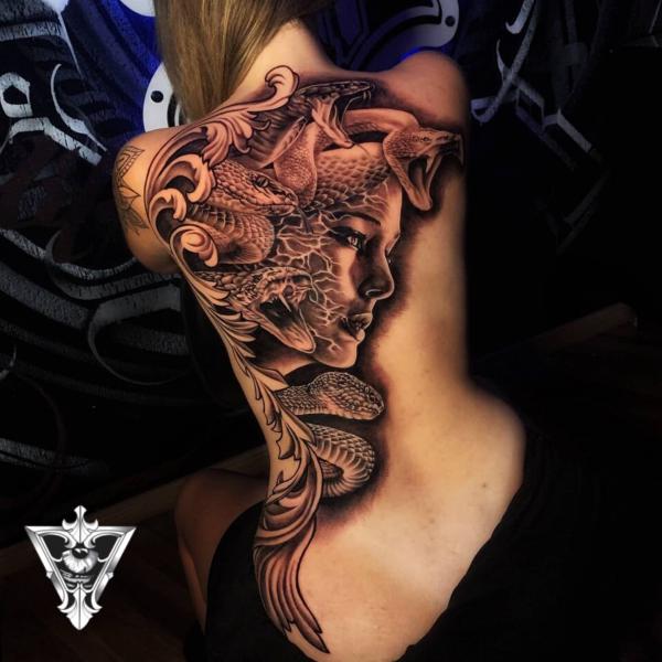 Medusa with snake tattoo on one side of back