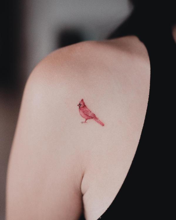 Minimalist cardinal shoulder blade tattoo
