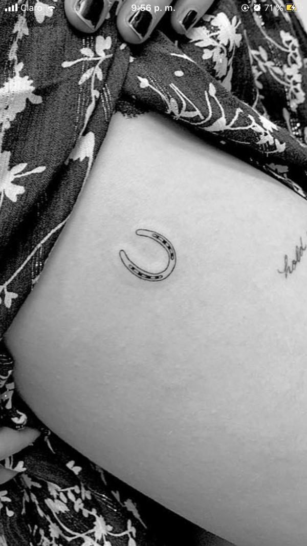 Minimalist horseshoe tattoo