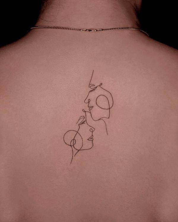 Mother and daughter outline back tattoo