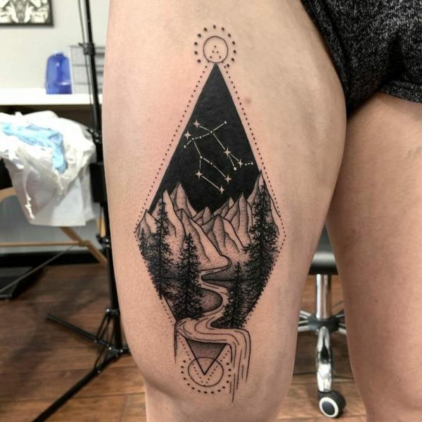 Mountain with constellation thigh tattoo