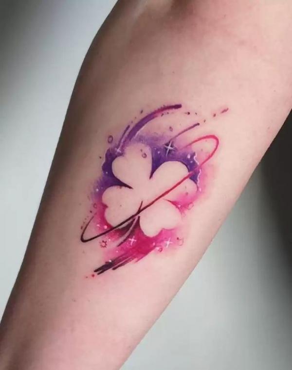 Negative space shamrock with stars tattoo
