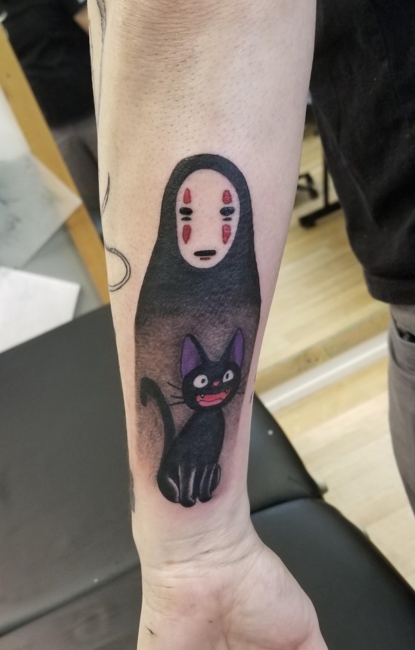 No Face and Jiji tattoo on forearm