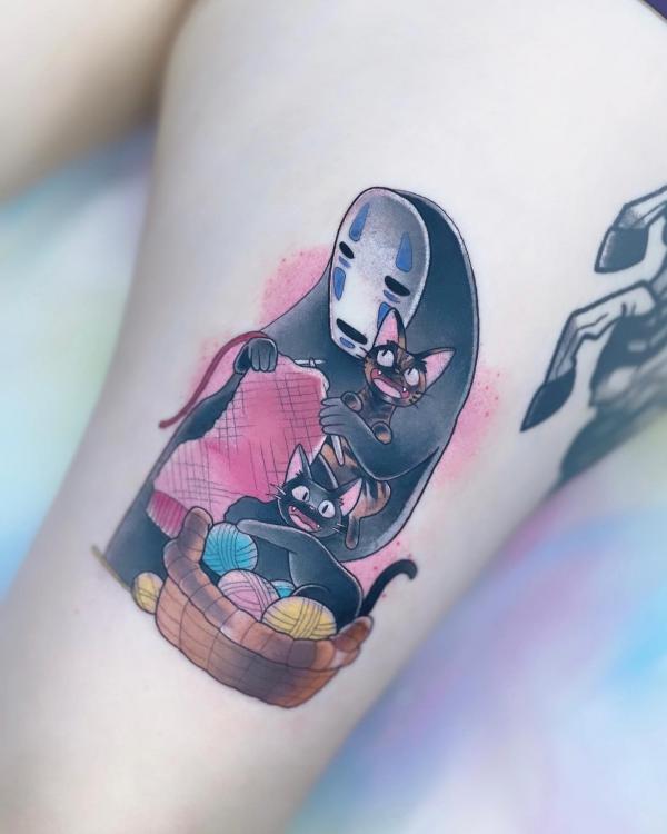 No Face and Jiji tattoo on thigh
