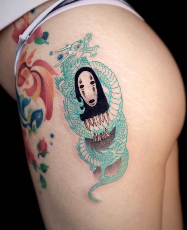No Face and dragon tattoo on the side of hip
