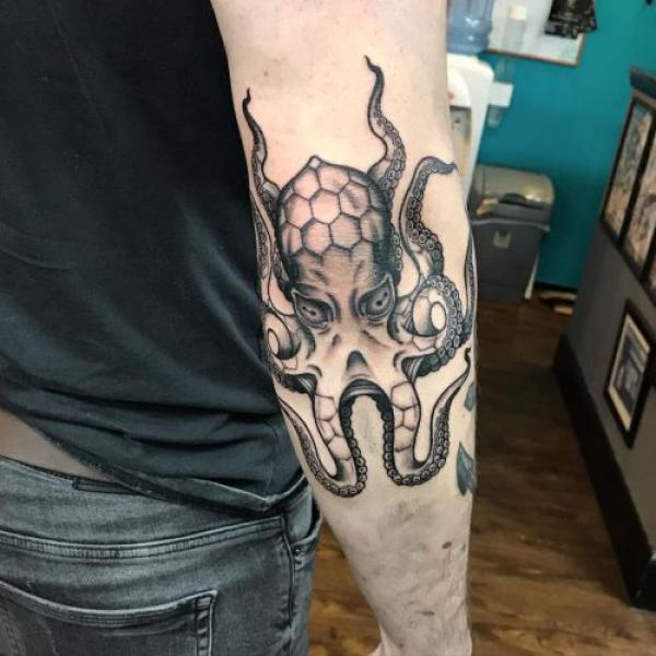 Octopus elbow tattoo black and white