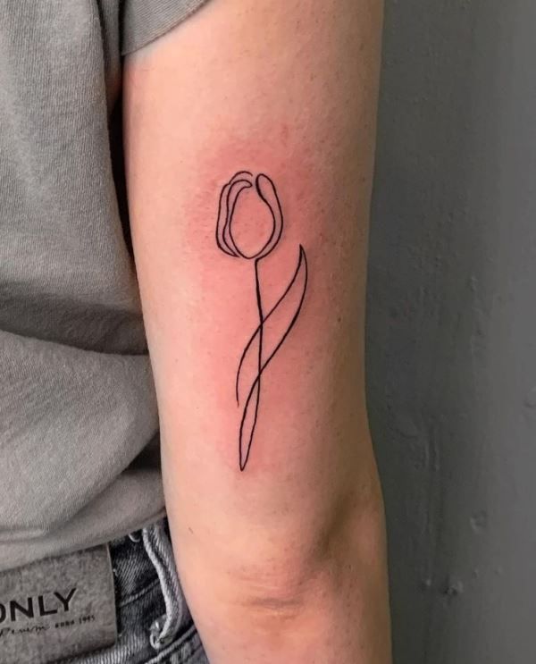 Outline tulip tattoo on forehand