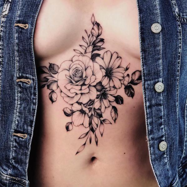 Peony and daisy sternum tattoo