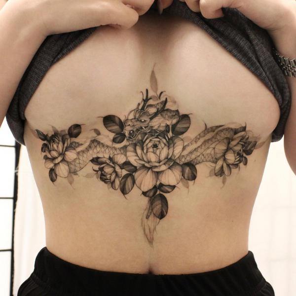 Peony and dragon sternum tattoo