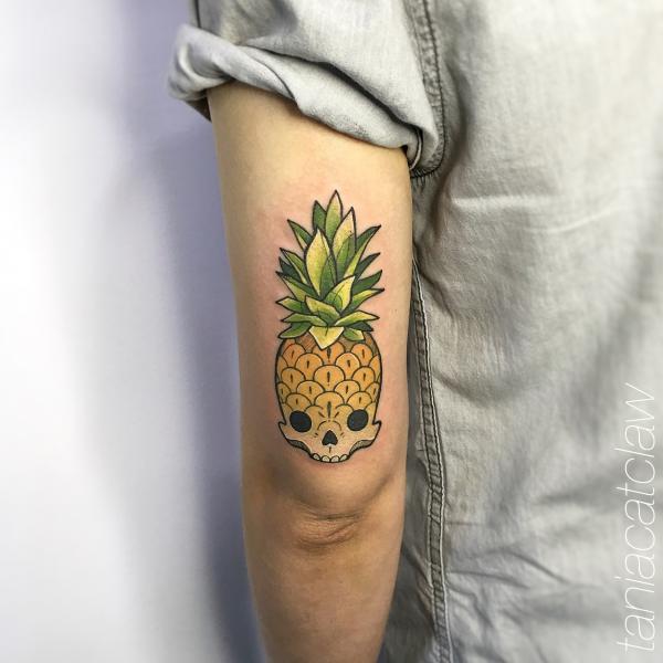Pineapple Skull tattoo above elbow