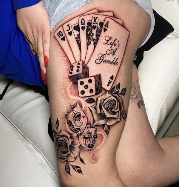 Playing cards with dice and Gemini twins with rose tattoo