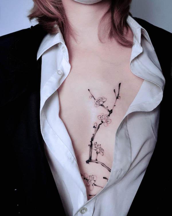 Plum blossom sternum tattoo