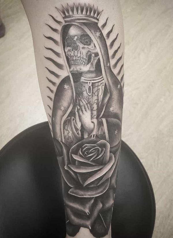Praying Santa Muerte with rose tattoo black and grey