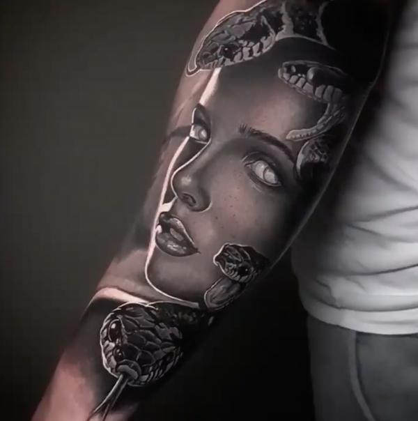 Realistic Medusa arm tattoo