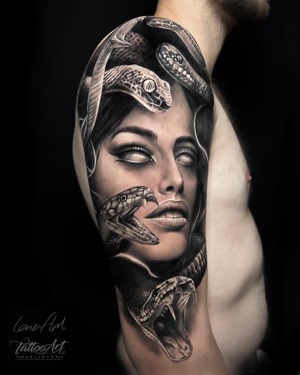 Realistic Medusa half sleeve tattoo