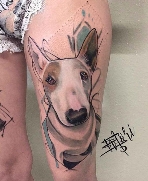 Realistic dog above knee tattoo