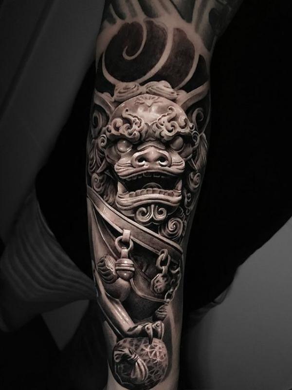 Realistic foo dog forearm tattoo
