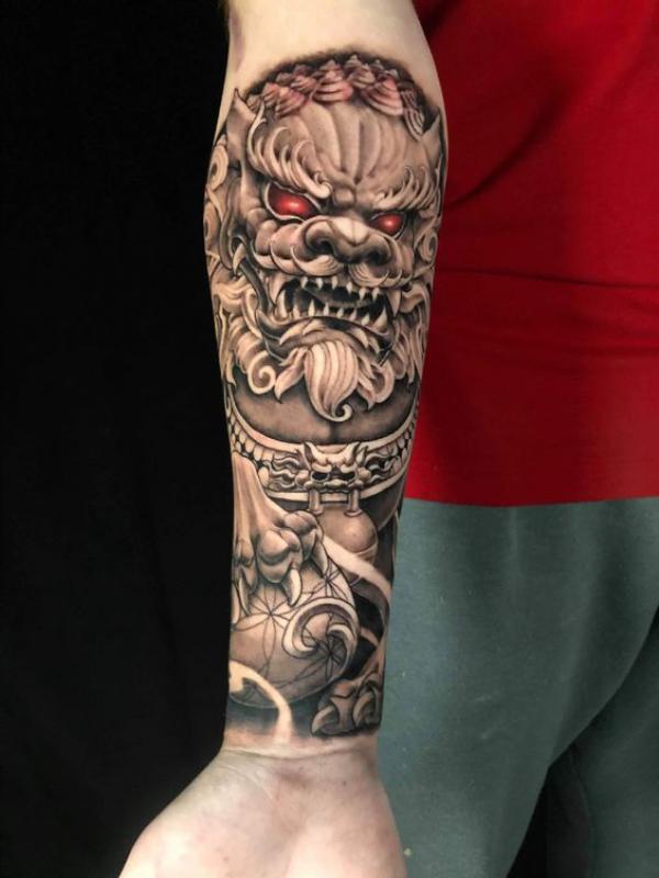Realistic foo dog inner forearm tattoo
