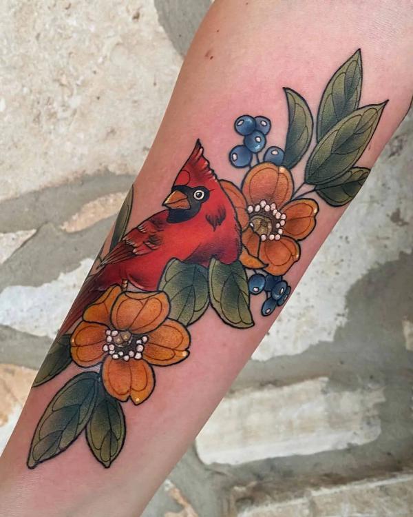 Red cardinal and dogwood flower with blueberry tattoo