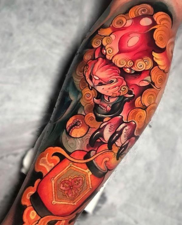 Red foo dog with omamori tattoo