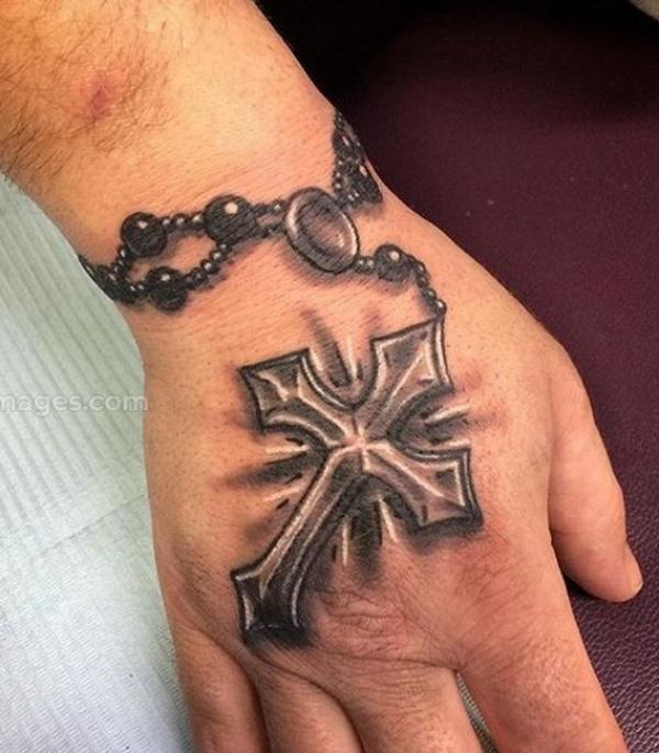 Rosary cross christian hand tattoo