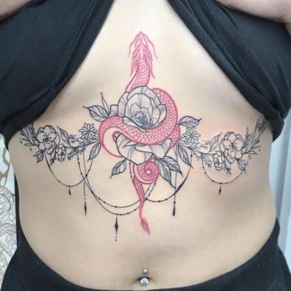 Rose and red dragon sternum tattoo