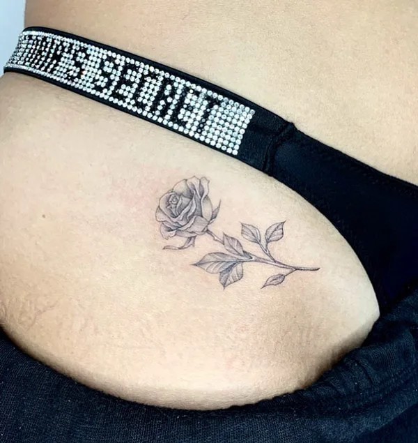 Rose bikini line tattoo black and grey