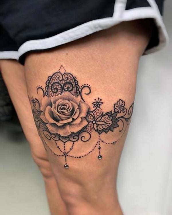 Rose garter above knee tattoo black and grey