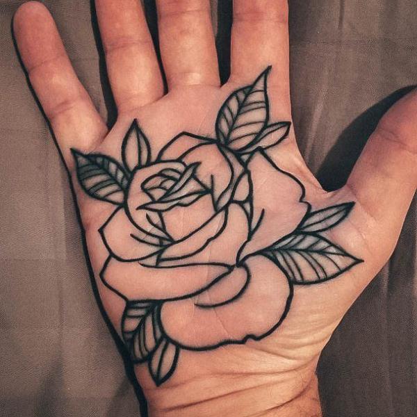 Rose outline palm tattoo