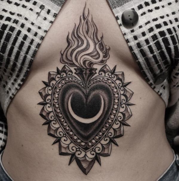 Sacred heart sternum tattoo