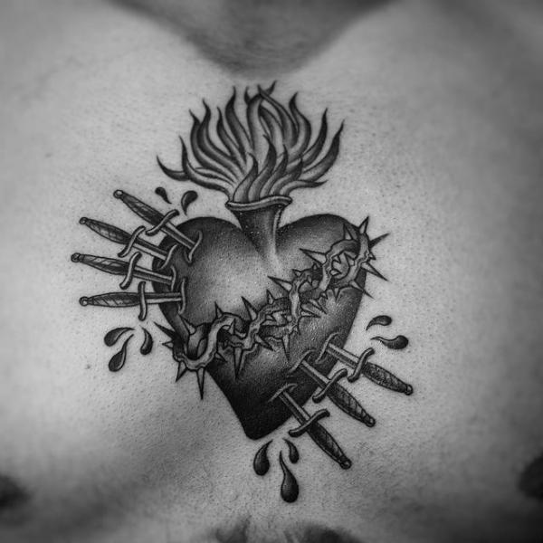 Sacred heart with daggers and thorns tattoo