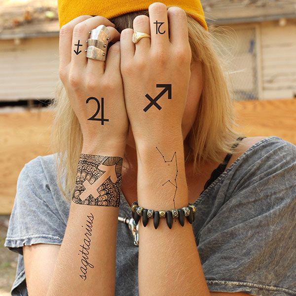 Sagittarius and Jupiter glyph hand tattoo