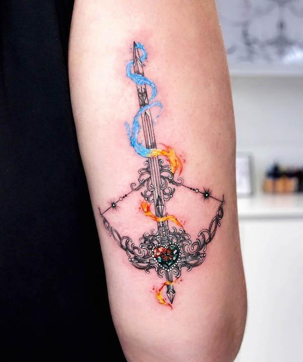 Sagittarius arrow and bow fire tattoo