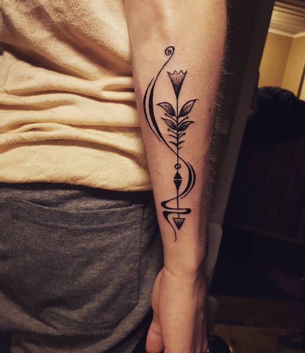 Sagittarius arrow outer forearm tattoo