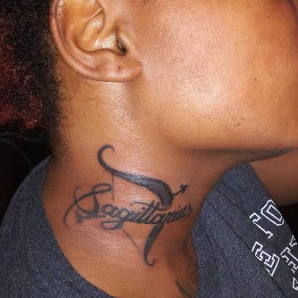 Sagittarius bow and arrow neck tattoo