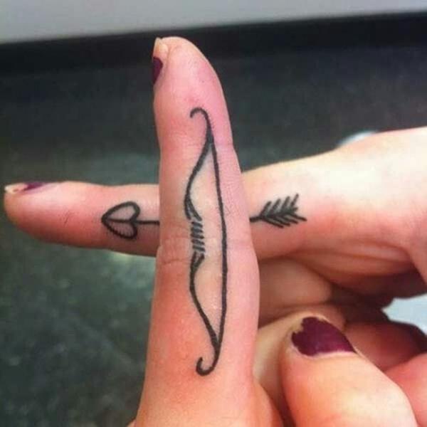 Sagittarius bow finger tattoo