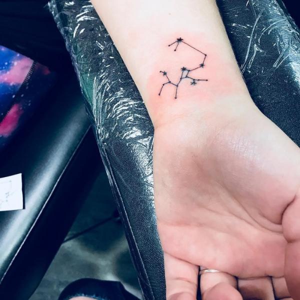 Sagittarius constellation wrist tattoo