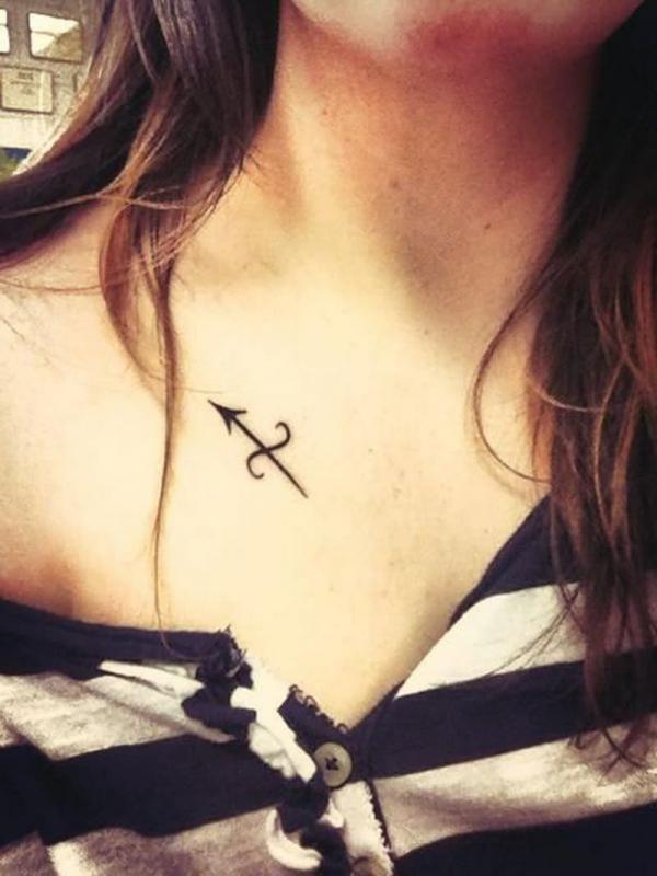 Sagittarius glyph clavicle tattoo