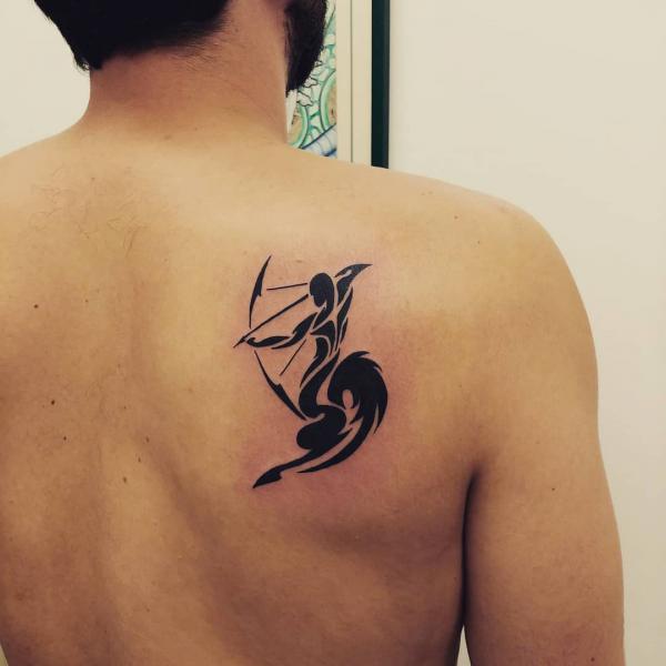 Sagittarius tribal shoulder blade tattoo