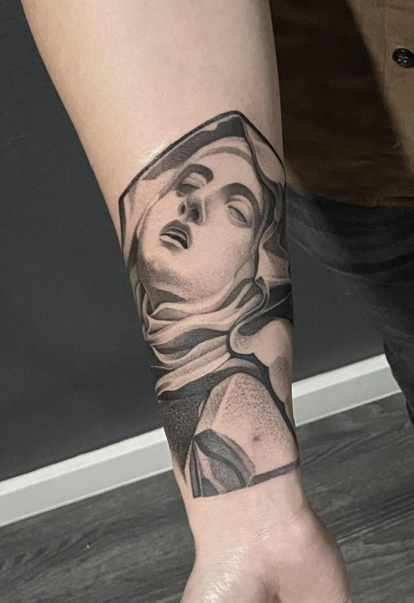 Saint Theresa of Avila forarm tattoo