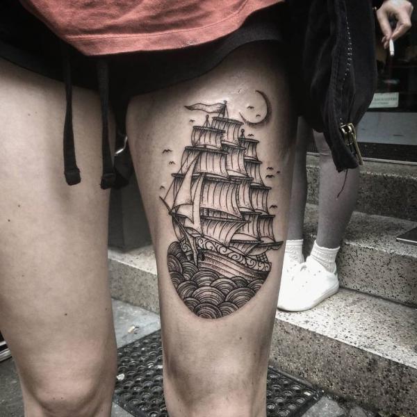 Ship above knee tattoo
