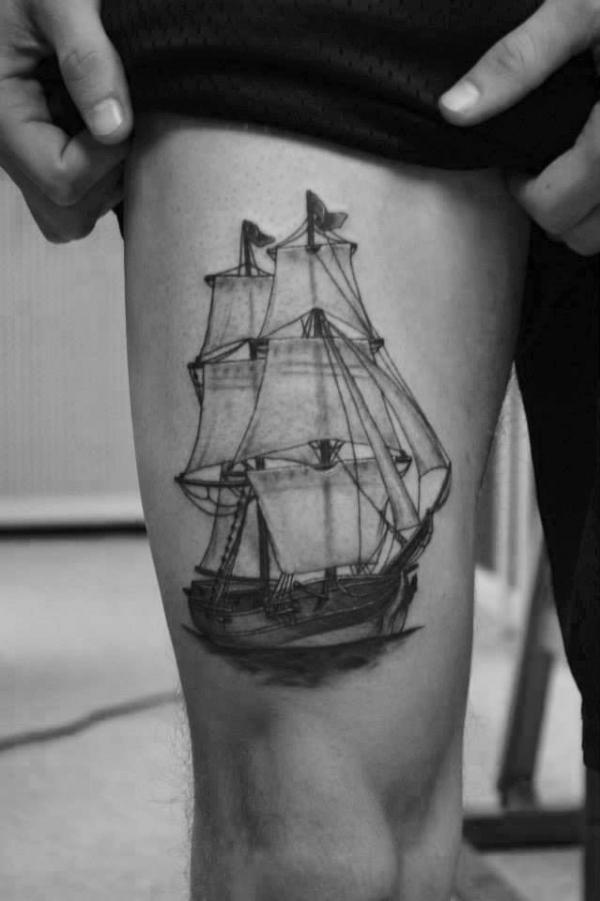 Ship tattoo above knee black and grel