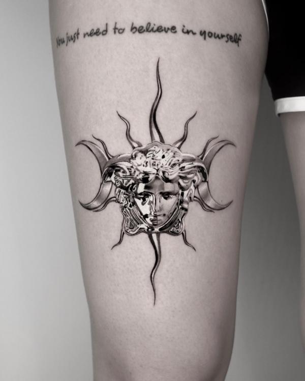 Silver Medusa thigh tattoo