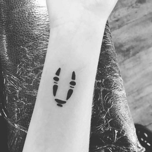 Simple abstract No Face forearm tattoo