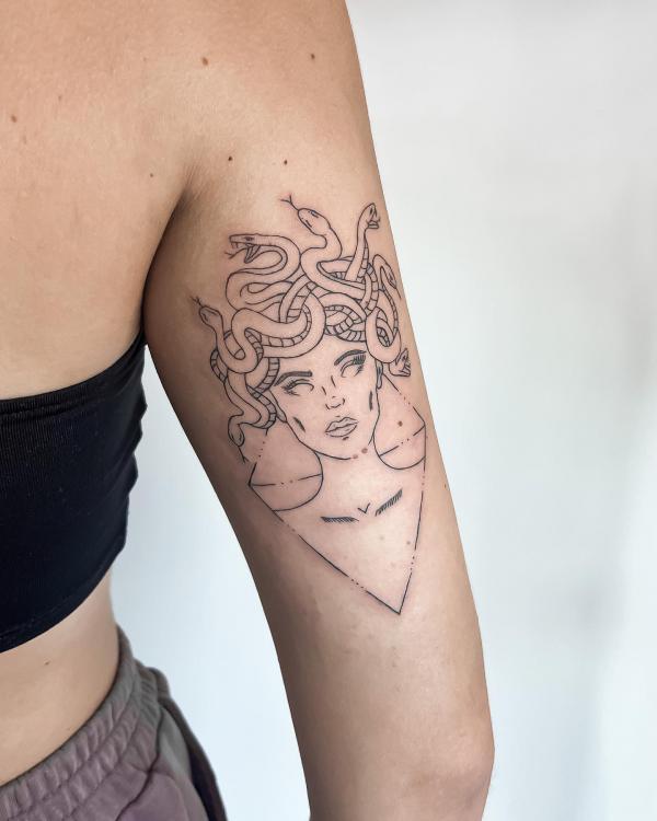 Simple medusa outline back of arm tattoo