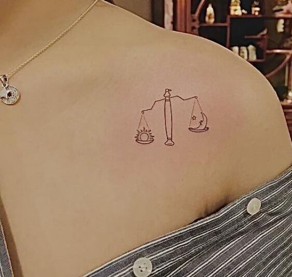 Simple sun and moon Libra clavicle tattoo