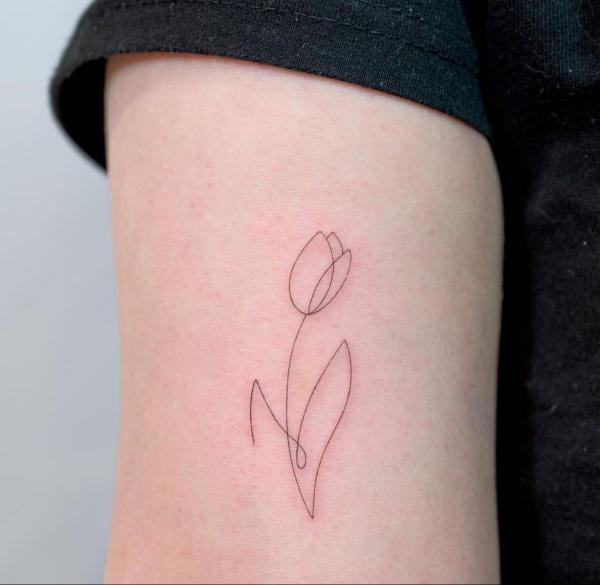 Simple tulip outline tattoo
