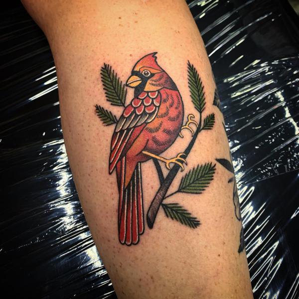 Single cardinal perched on branch tattoo traditional