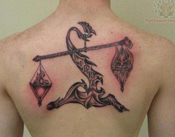 Skull and heart Libra back tattoo