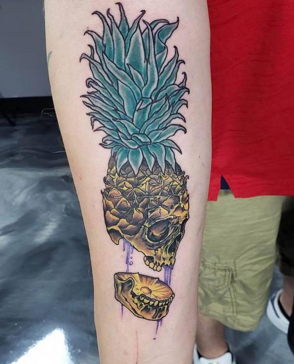 Sliced Pineapple Skull forearm tattoo